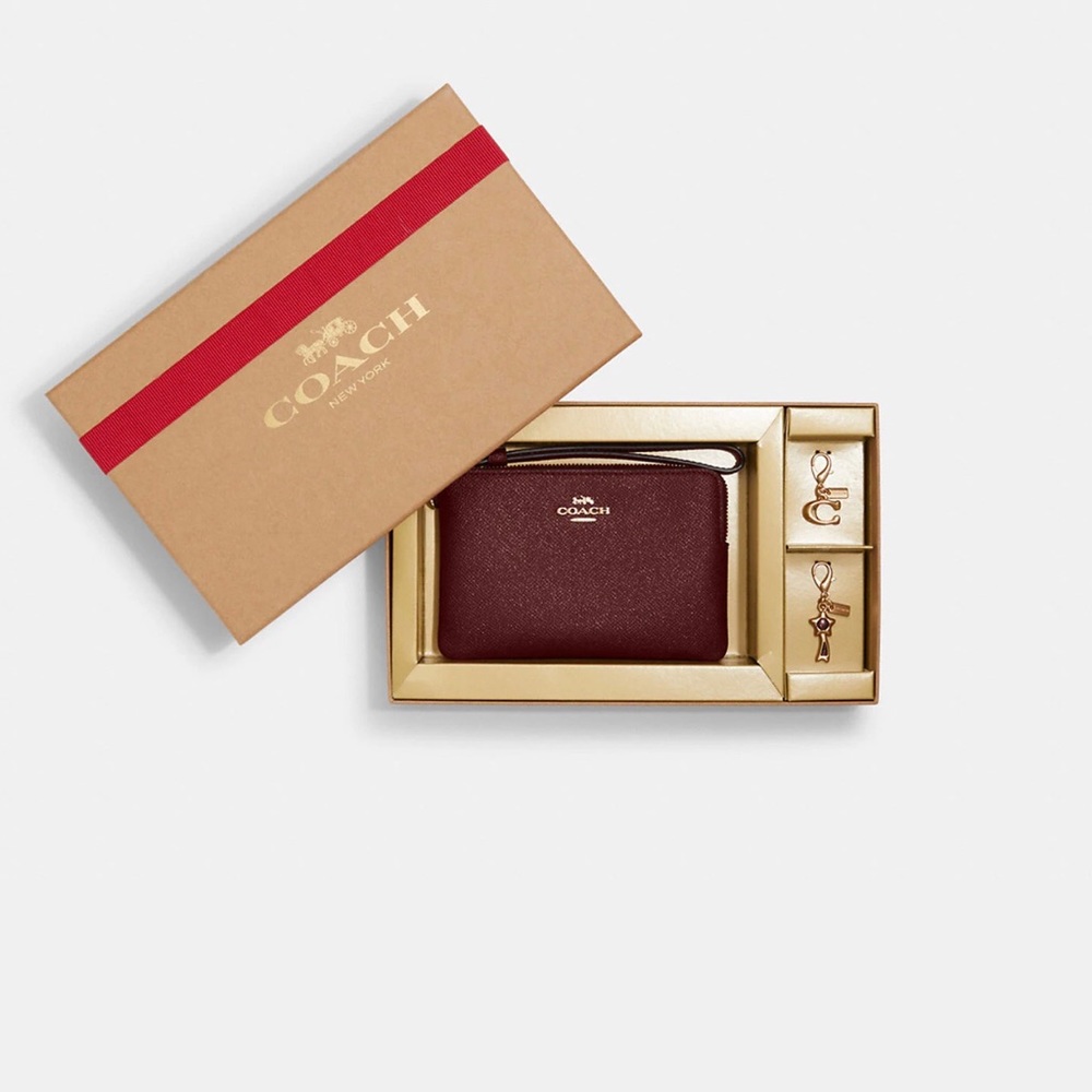 NWT Coach Boxed Corner Zip Wristlet & two detachable charms. Color:Black Cherry.